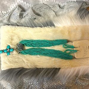 New necklace and earrings. Silver toned accents.